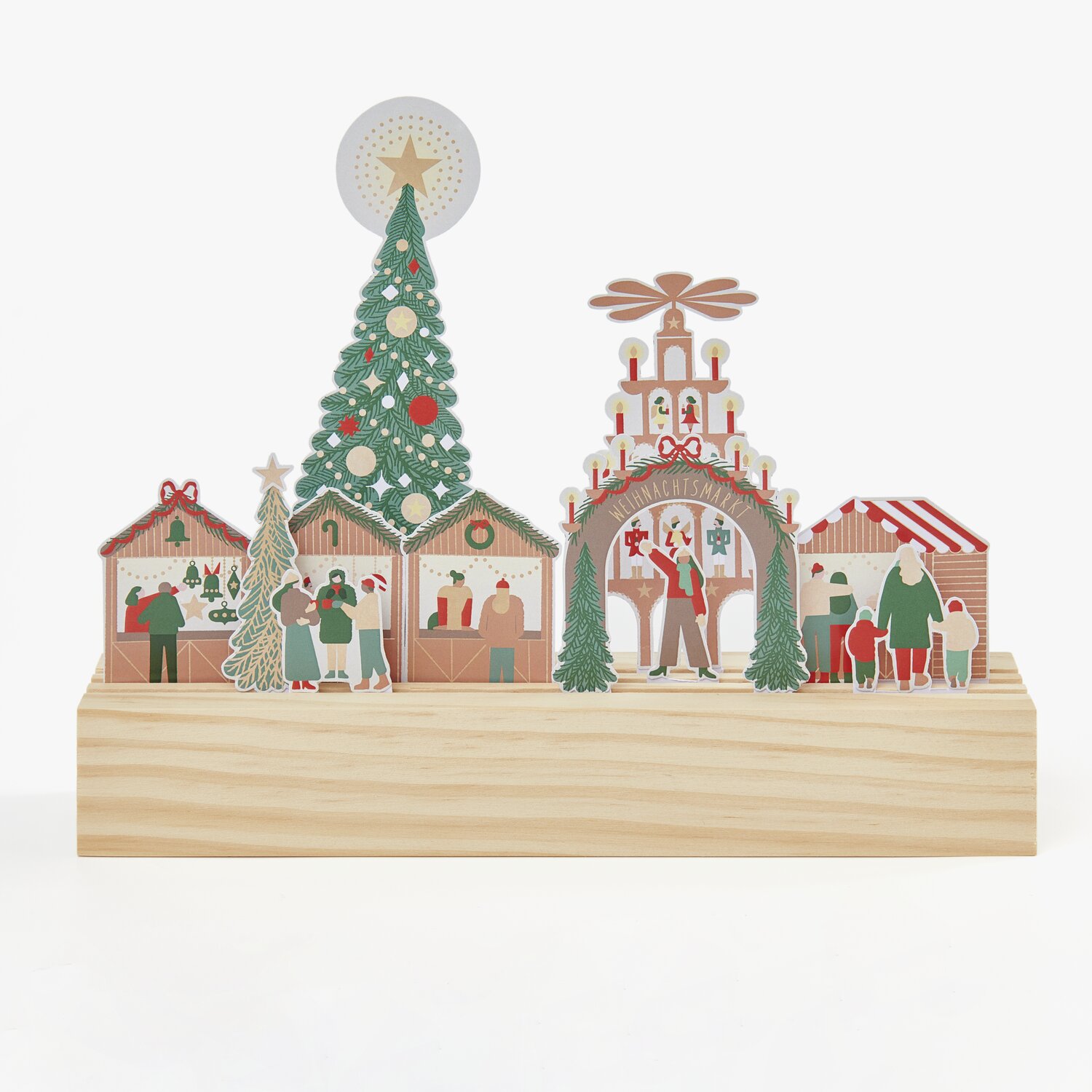 Paper Poetry Motivpapierblock Weihnachtsmarkt zeigt eine festliche Szene mit Weihnachtsbaum und Marktständen auf hellem Hintergrund.