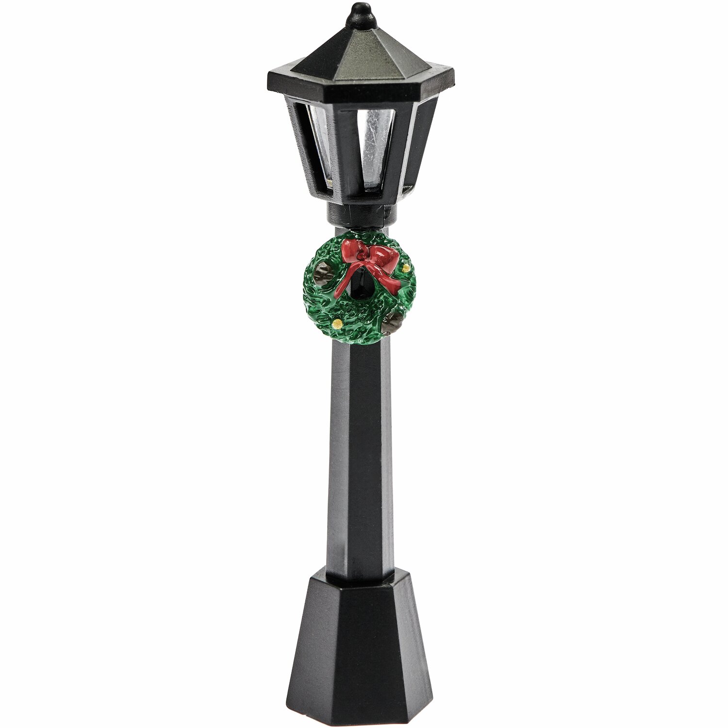 Miniatur Straßenlaterne von Rico Design, schwarz, mit dekorativem Weihnachtskranz und roter Schleife. Ideal für Modelleisenbahnen und Miniaturwelten.