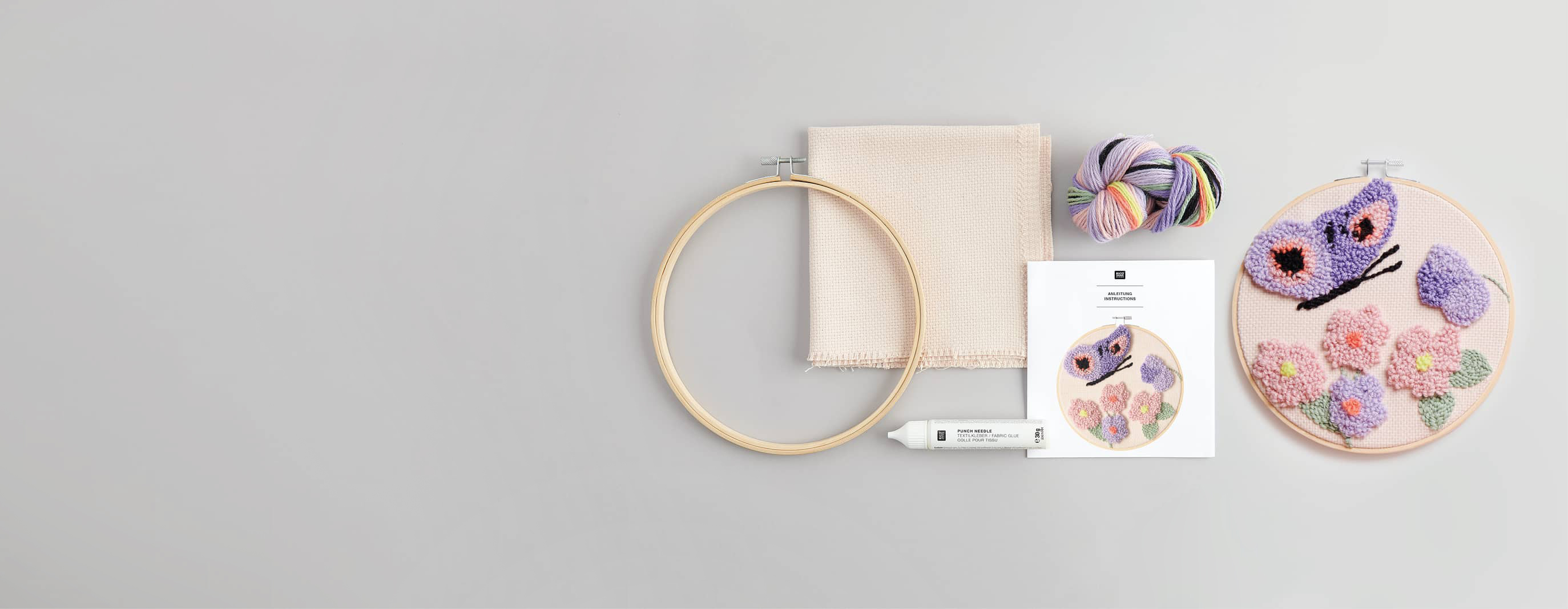 Zubehör und Punch Needle Bild mit Schmetterling und Blumen