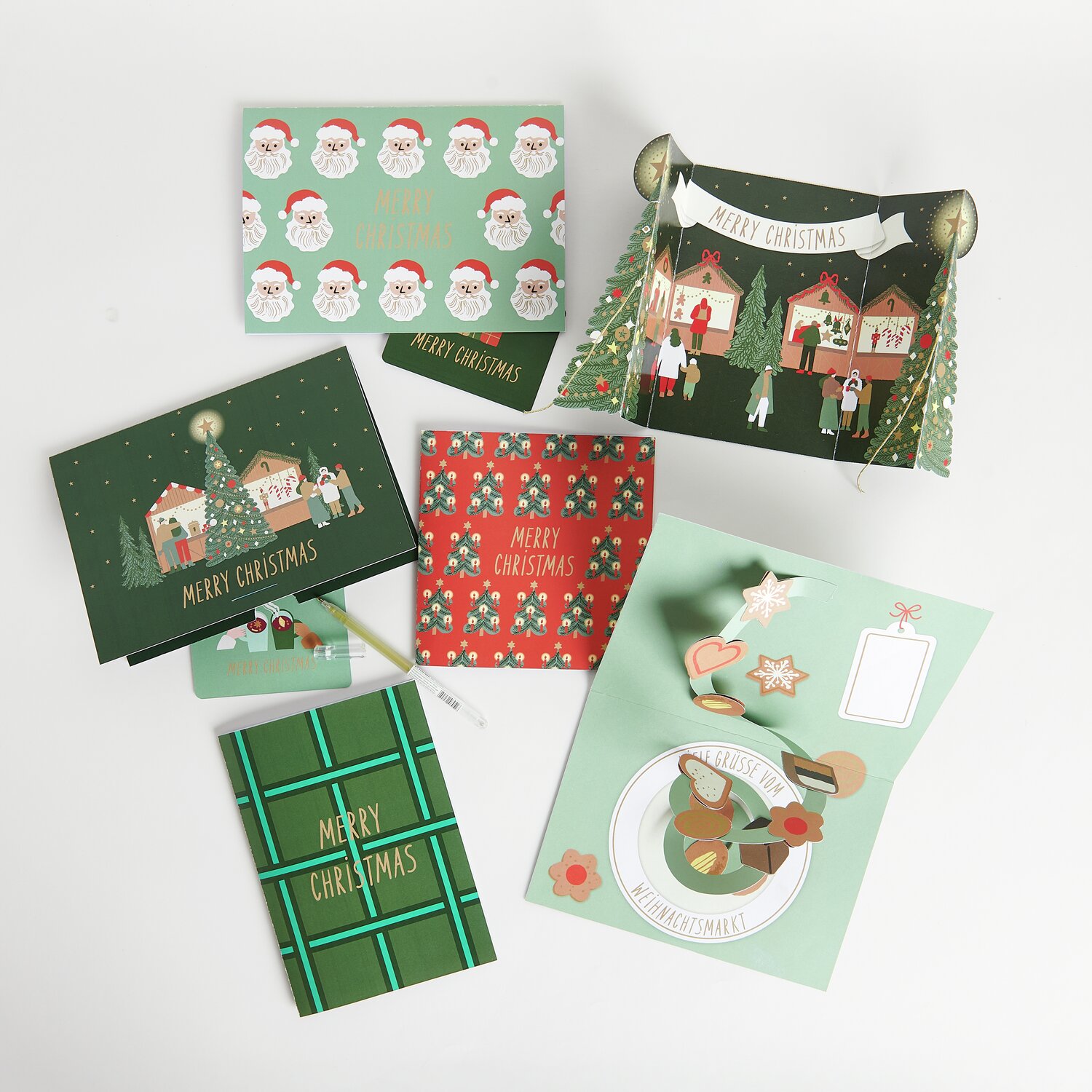 Pop-Up Karte Merry Christmas: Verschiedene festliche Karten in Grün und Rot, ideal für Weihnachtsgrüße und Geldgeschenke.