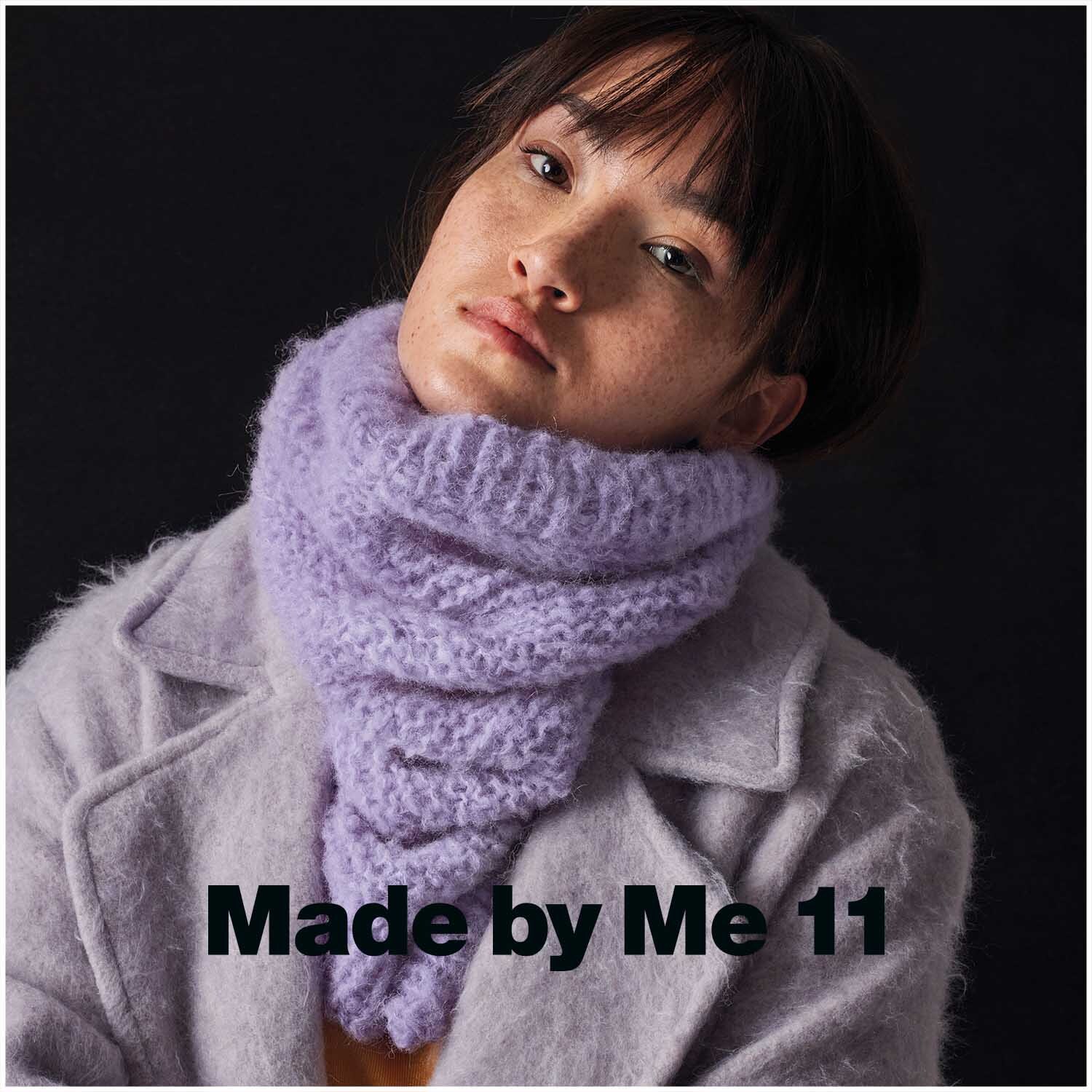 Fashion Light Luxury 50g 130m Farbe Flieder von Rico Design Fashion Light Luxury: Frau trägt fliederfarbenen Schal von Rico Design, gestrickt aus weichem Garn, ideal für stilvolle Wintermode.