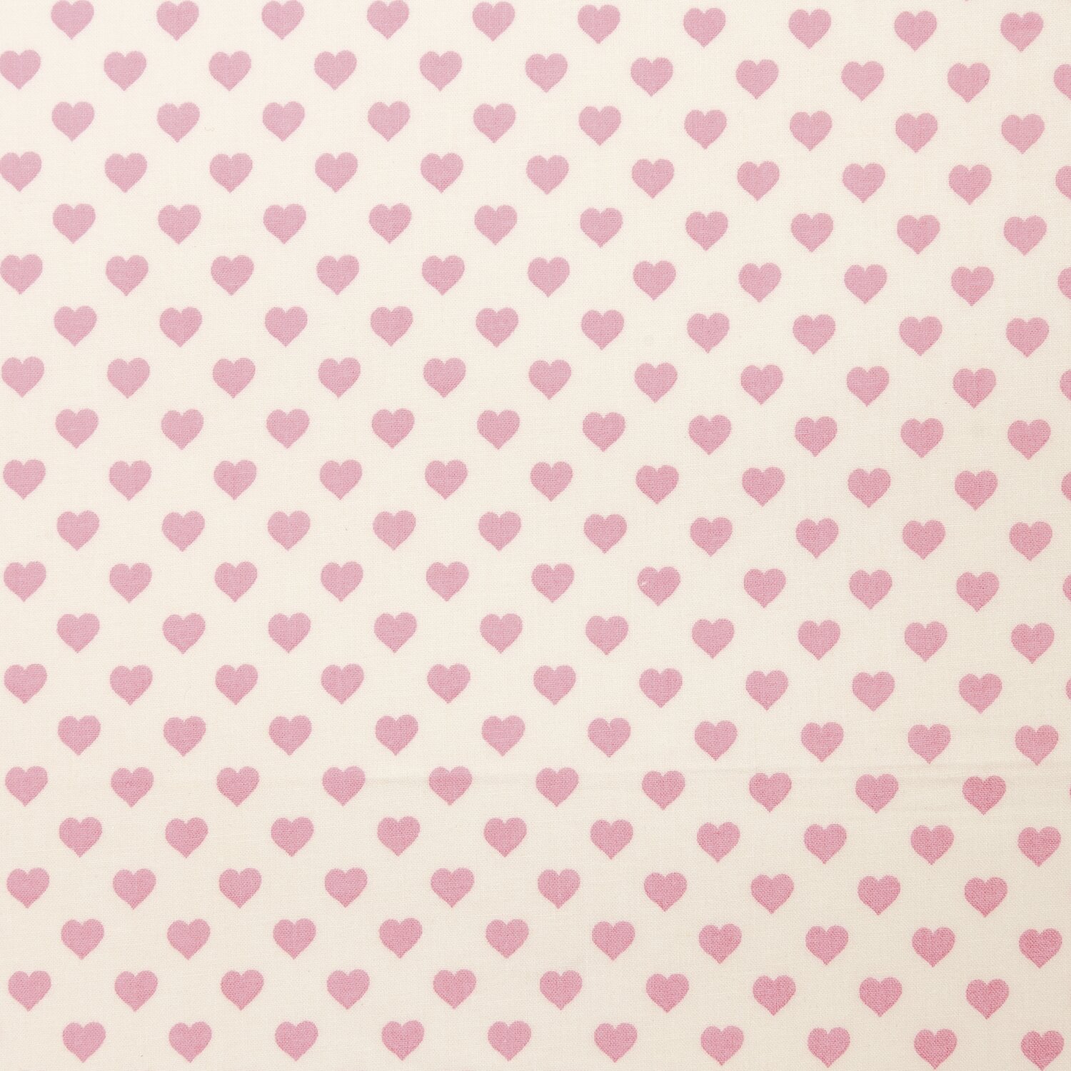 Druckstoff Herzen hellgelb-rosa 140cm mit rosa Herzmuster auf hellgelbem Hintergrund von Rico Design. Ideal für kreative Nähprojekte.