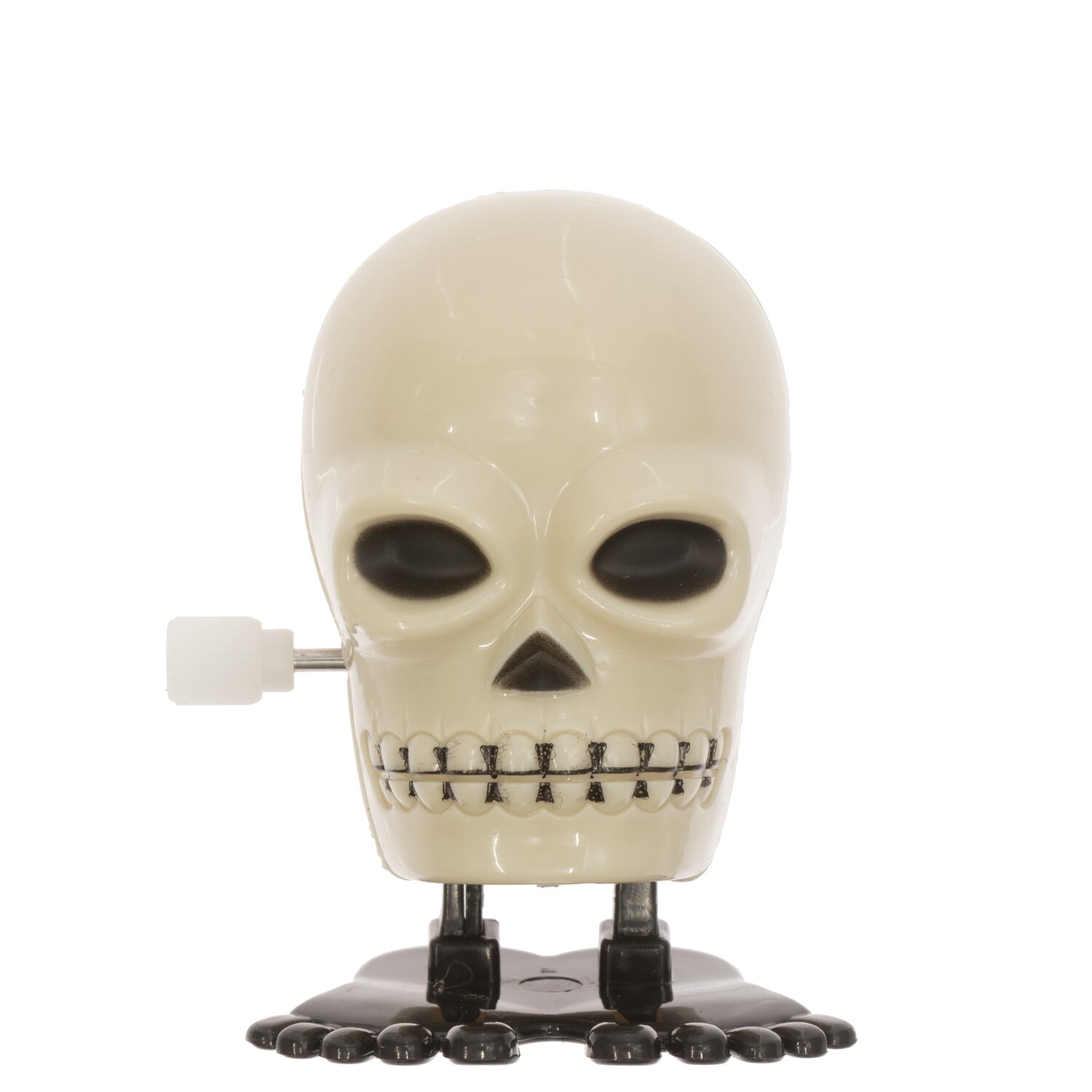 Aufziehfigur Totenkopf 5cm: Weiße Totenkopf-Figur mit schwarzen Augen und Füßen, ideal für Halloween-Dekorationen.
