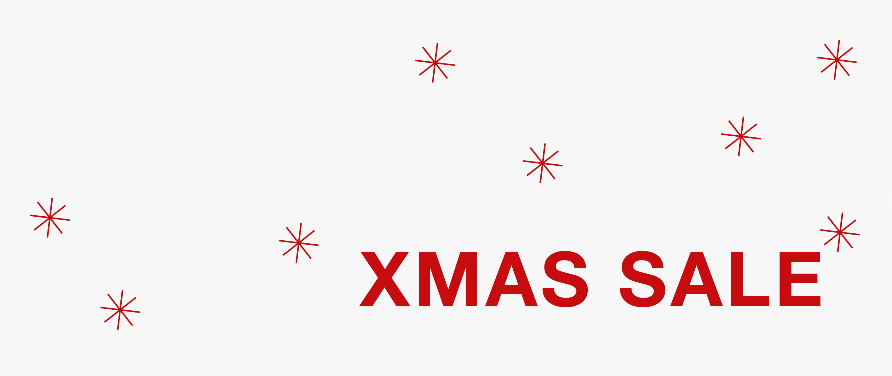 In roter Schrift und umgeben von illustrierten Schneeflocken, steht der Schriftzug Xmas Sale auf hellgrauem Hintergrund.