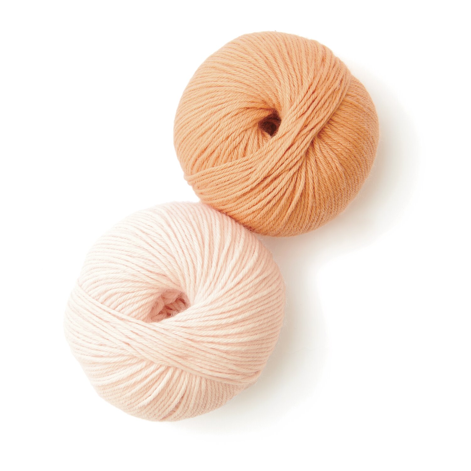 Rico Baby 042 Sprachauswahl deutsch von Rico Design Rico Baby 042: Zwei Wollknäuel in Apricot und Lachs, ideal für weiche Strickprojekte.