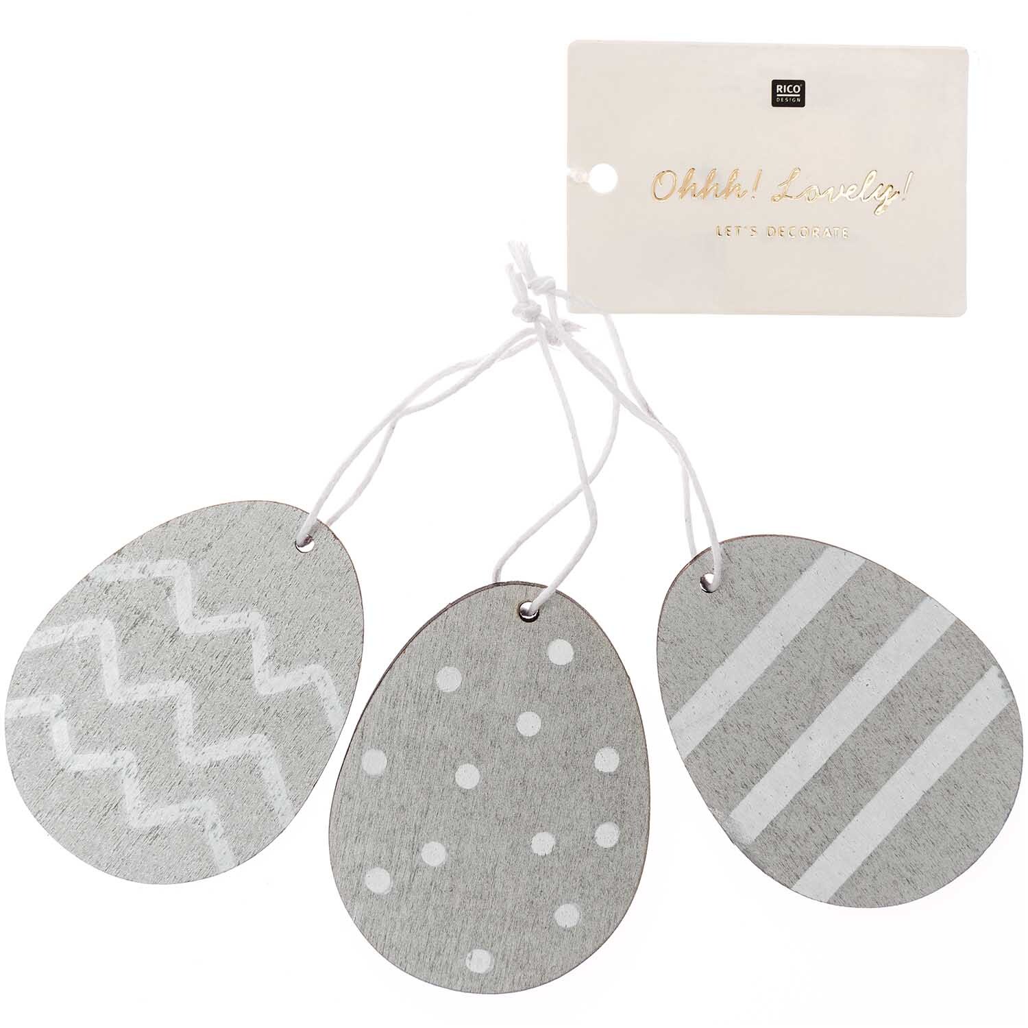 Holzhänger Osterei 3 Stück in Silber von Rico Design, mit verschiedenen Mustern auf jedem Ei.