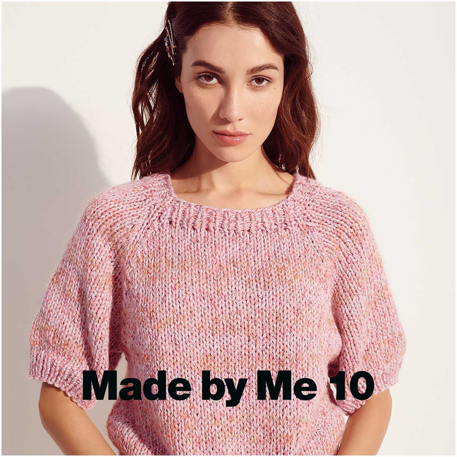 Essentials Super Kid Mohair Loves Silk 25g 200m Farbe Karamell von Rico Design Essentials Super Kid Mohair Loves Silk: Frau trägt gestrickten Pullover in Rosa, 25g 200m, von Rico Design.