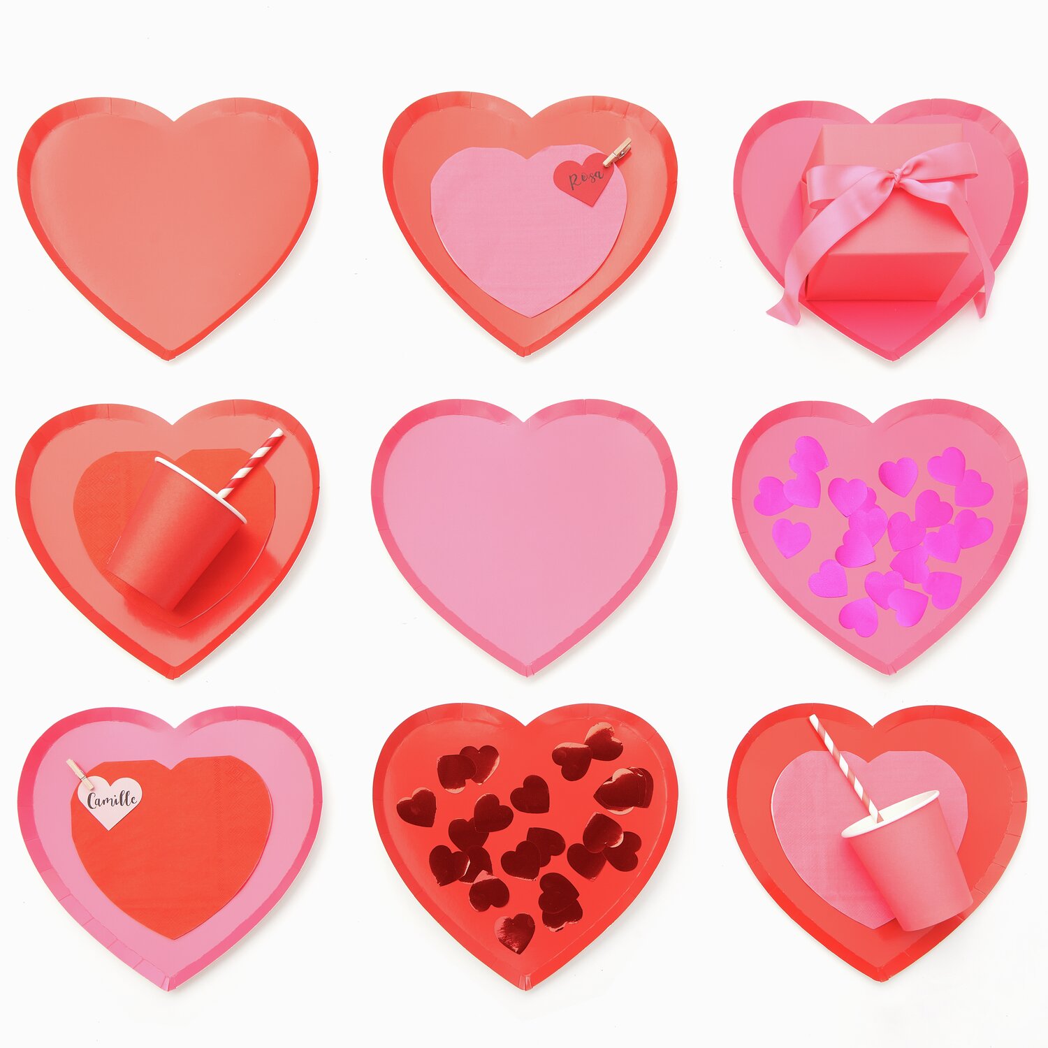 Pappteller Herz 8 Stück in Rot und Neon Pink, dekoriert mit Pappbechern und Servietten. Perfekt für festliche Anlässe und Partys.