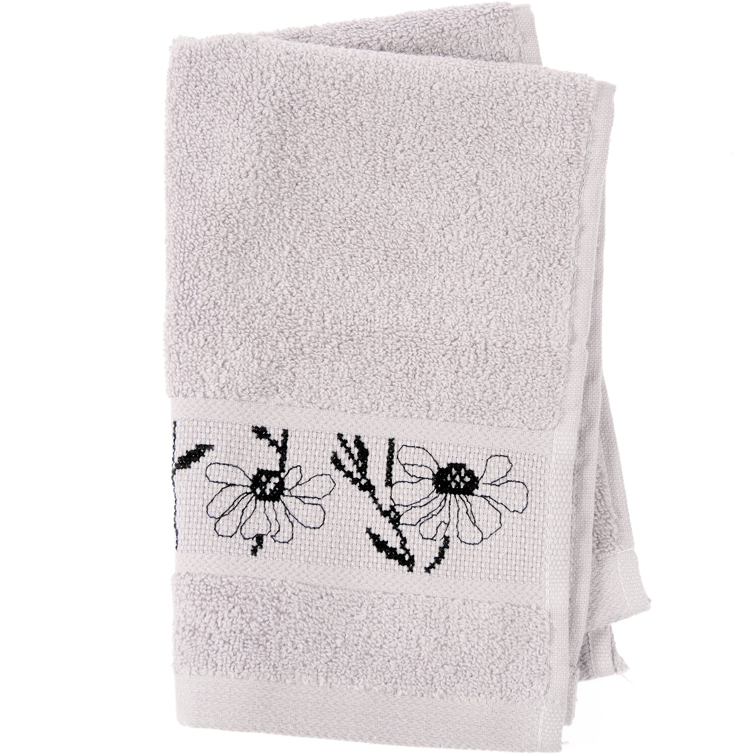 Stickset Gästetuch, Flieder Modell 80853 aus Stickbuch 186 zeigt ein weiches Gästehandtuch mit eingewebter Kreuzstich-Bordüre und schwarzem Blumenmotiv.
