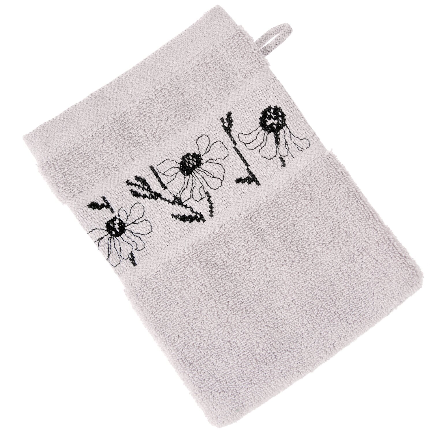Stickset Waschhandschuh, Flieder Modell 80853 aus Stickbuch 186 zeigt einen hellen Frottee-Waschhandschuh mit schwarzem Blumen-Stickmuster und Aufhänger.