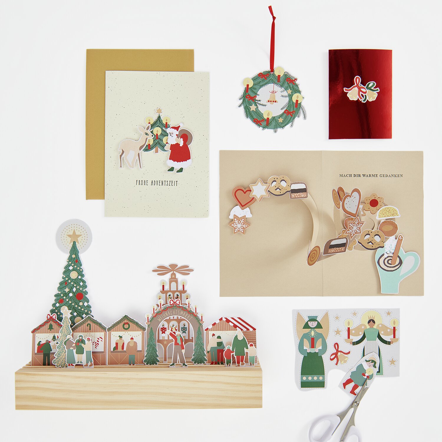 Paper Poetry Motivpapierblock Weihnachtsmarkt mit 22 Blatt, zeigt festliche Designs und Dekorationen. Ideal für kreative Weihnachtsprojekte.