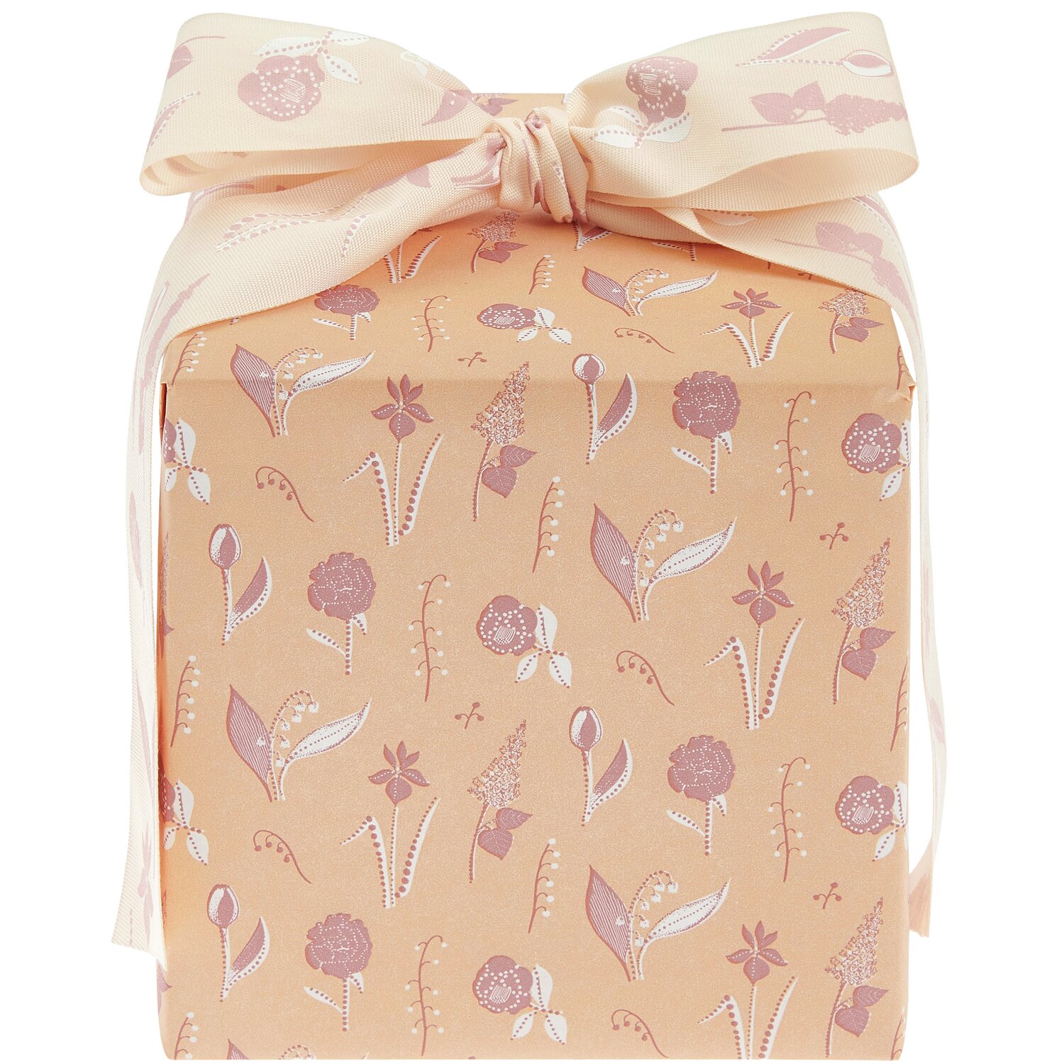 Geschenkpapier Blumenwiese: Orangefarbenes Papier mit floralen Mustern, ideal für Frühlingsgeschenke.