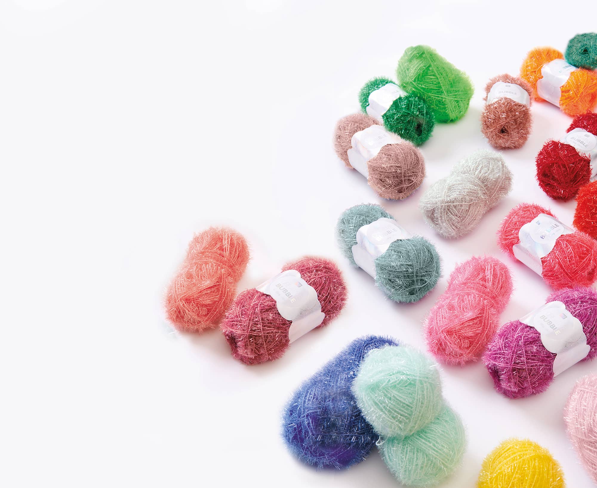 Knäuel des Garns Creative Bubble in verschiedenen Farben