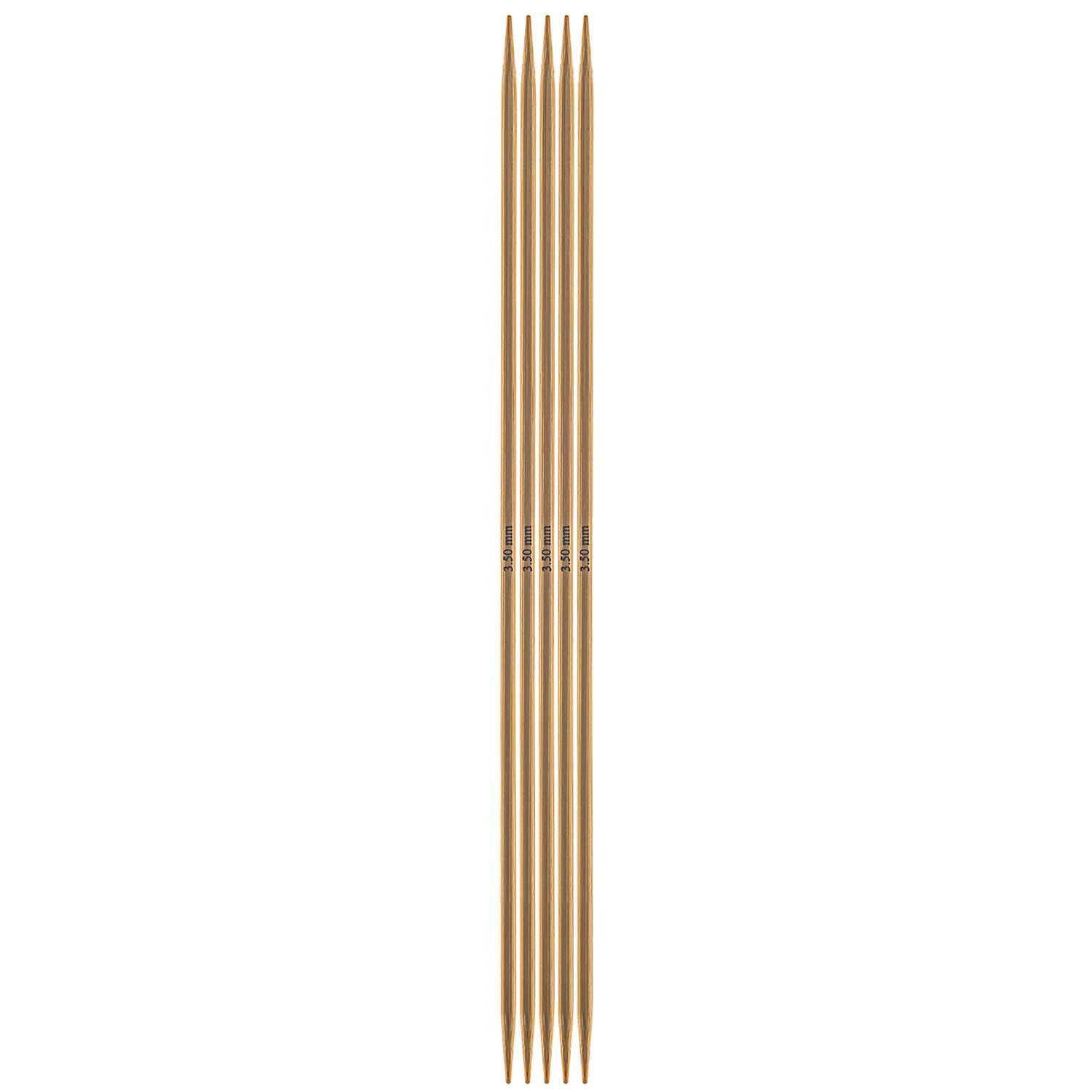 Nadelspiel 20cm Bambus von Rico Design, bestehend aus fünf glatten, hellbraunen Stricknadeln.